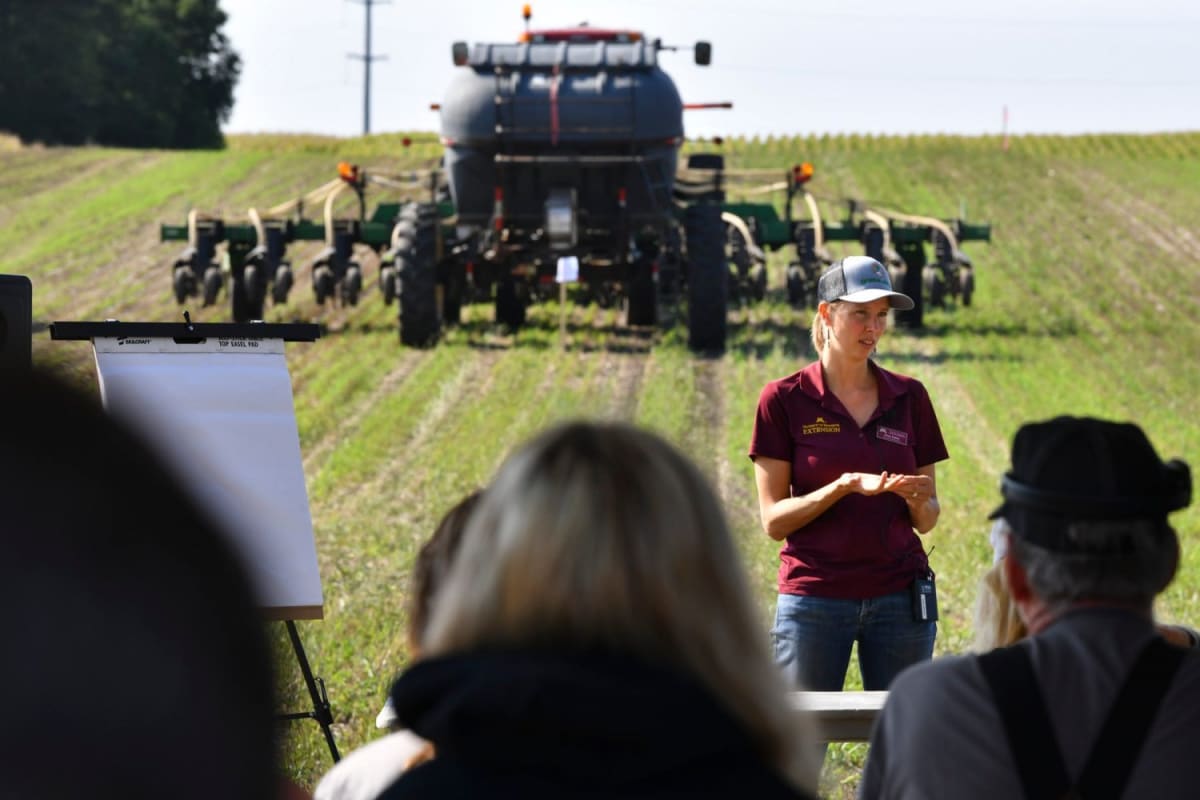 Minnesota reporter interviewing farmers at agricultural conference about climate practices