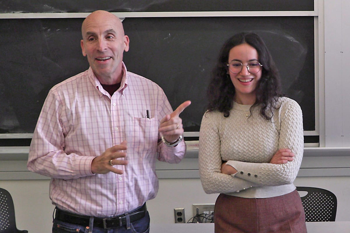 Instructor and student discussing entrepreneurship in MIT mechanical engineering classroom
