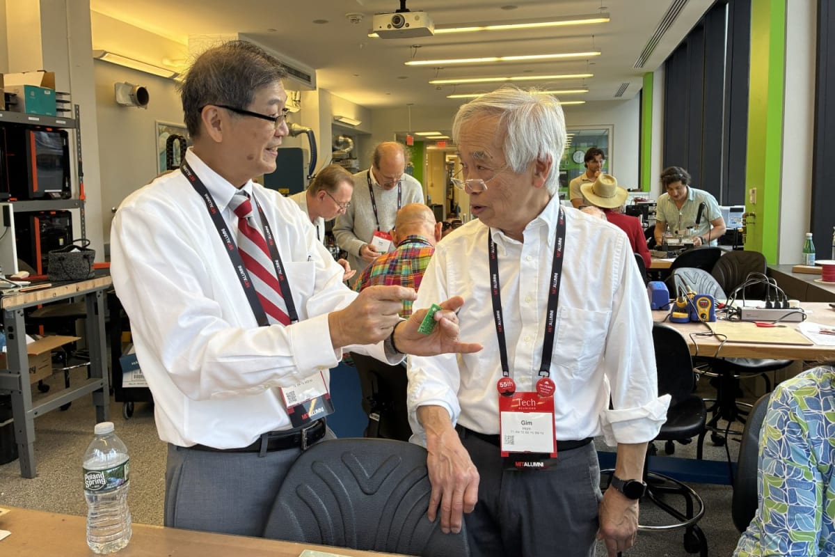 Alumni from MIT's Class of 1971 soldering electronic circuit boards during their 55th reunion workshop