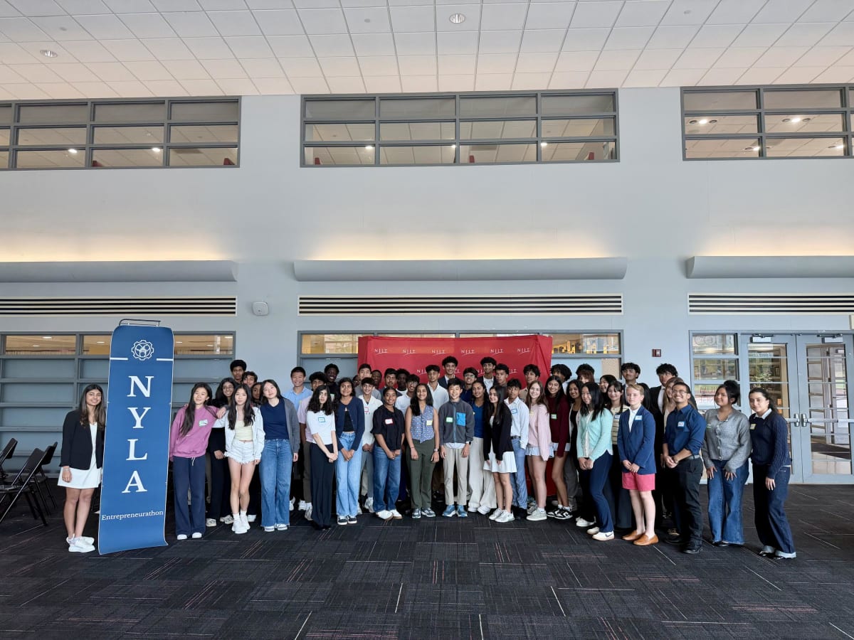 Diverse group of teenage students collaborating on startup ideas at NJIT Entrepreneurathon event