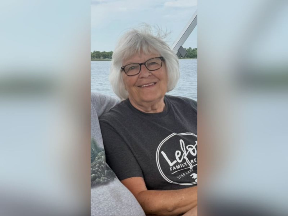 Retired teacher Verna Rasmussen smiling at her lake sanctuary in North Dakota