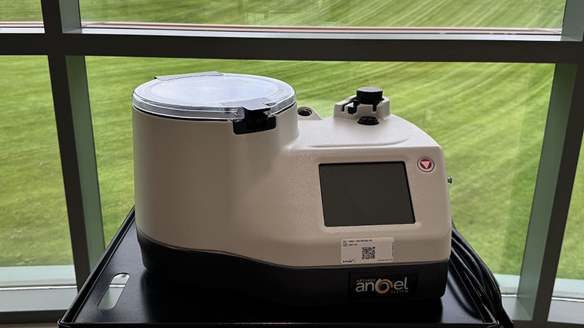 Medical professional preparing platelet-rich plasma injection using advanced blood separation technology