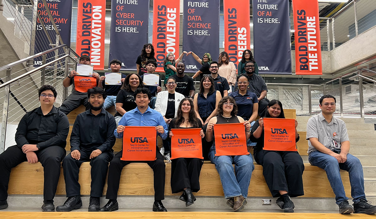 High school students presenting their community-focused business solutions at UT San Antonio