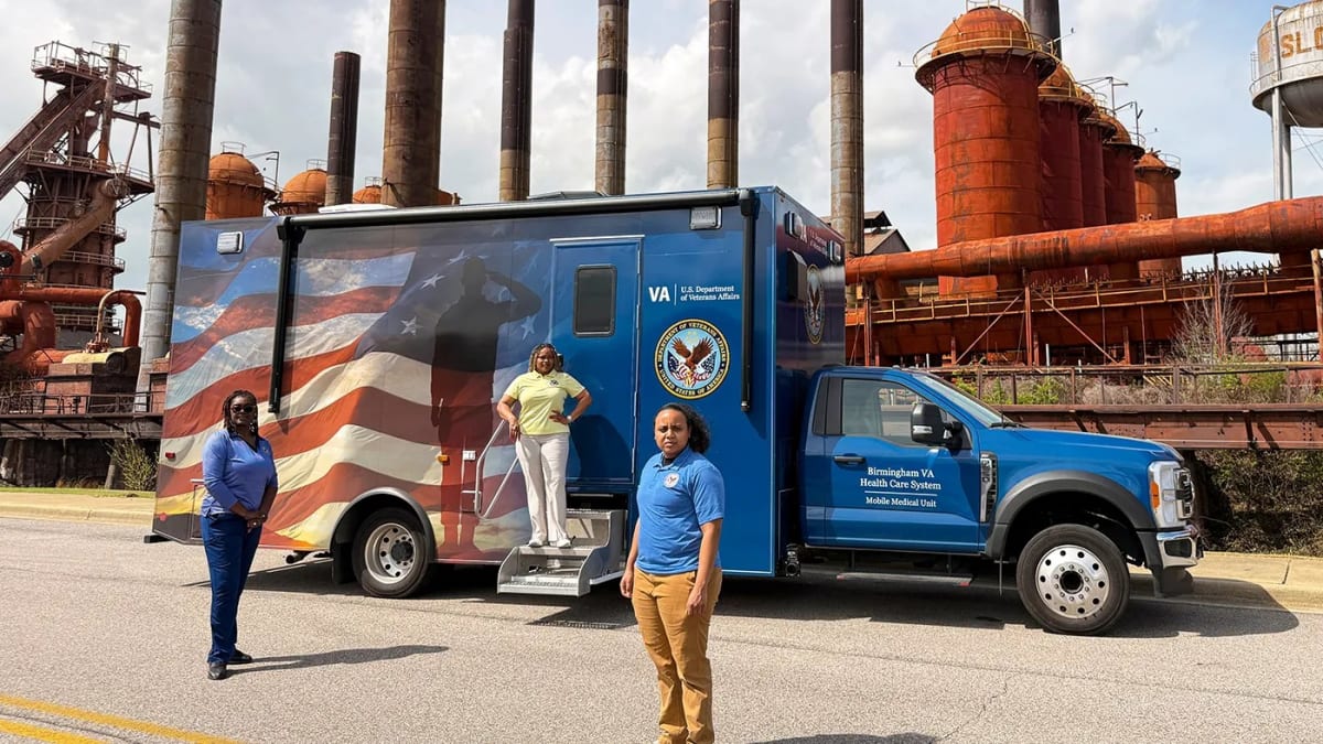 VA Mobile Medical Unit van parked outside residential building during wellness check visit