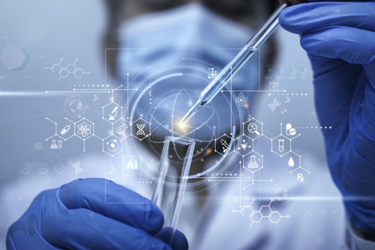 Scientists working in modern cancer research laboratory with microscopes and medical equipment