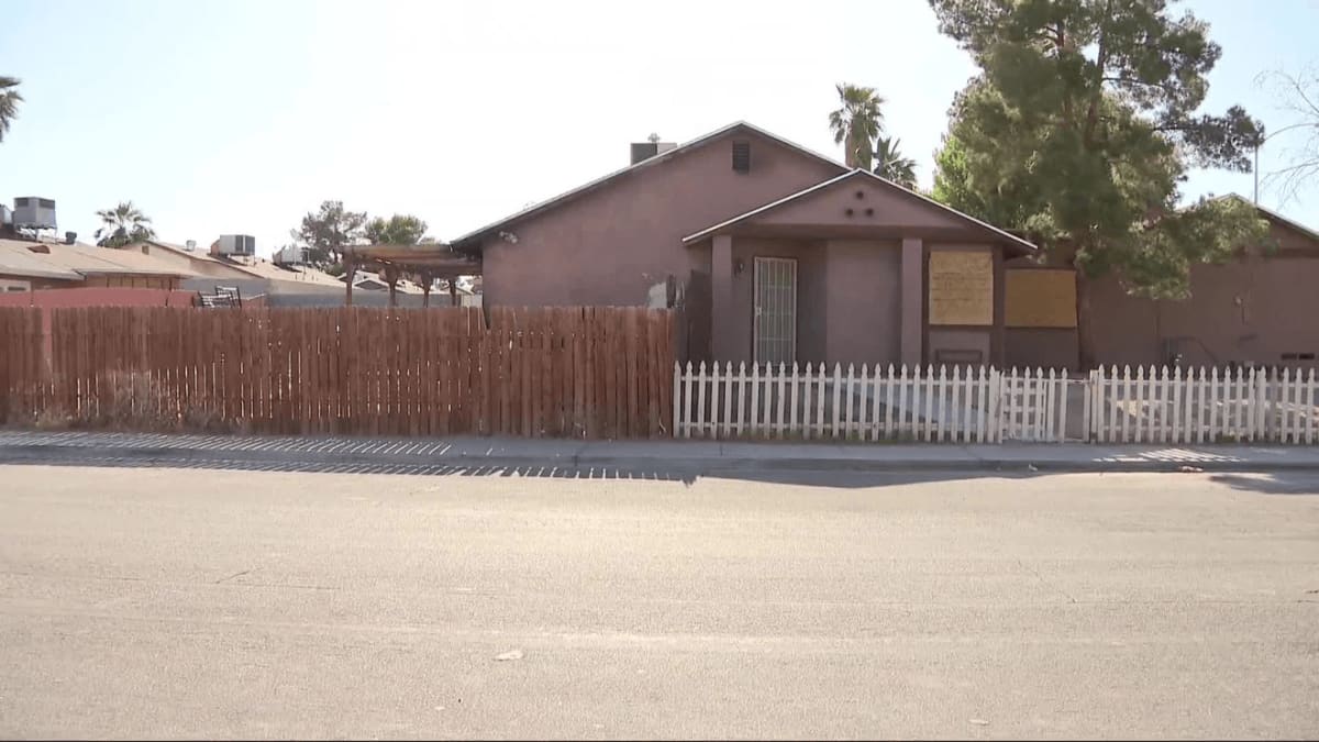 Exterior view of Las Vegas home damaged by backyard fire that good samaritan helped extinguish