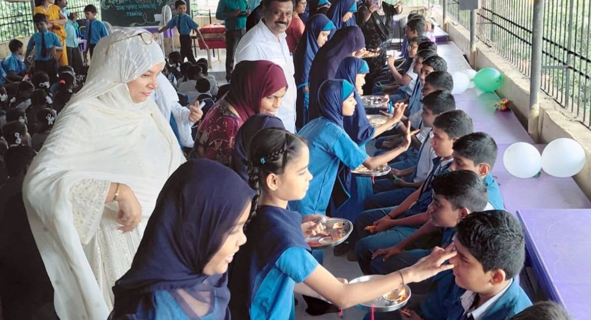Students from different religious backgrounds exchange friendship bracelets during joint school celebration in Kalyan