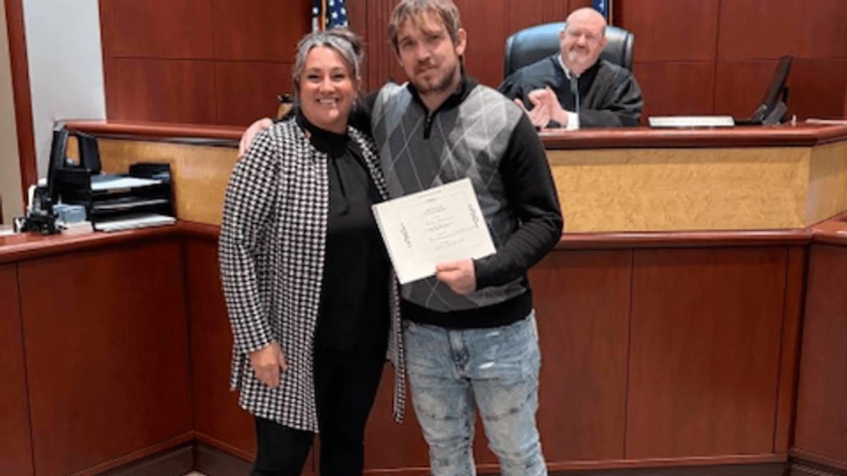 Graduate celebrating completion of Georgia's combined mental health and addiction treatment court program