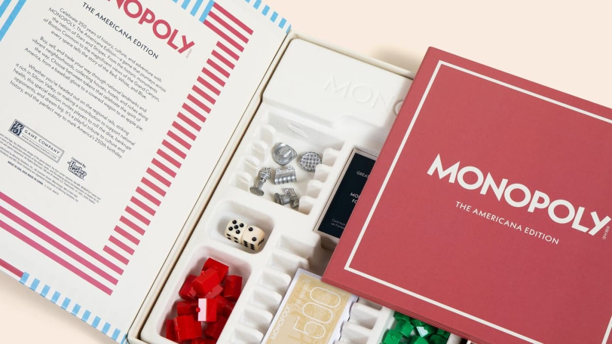 Custom metal Monopoly game pieces shaped like cowboy hats, covered wagons, and apple pies made in Indiana