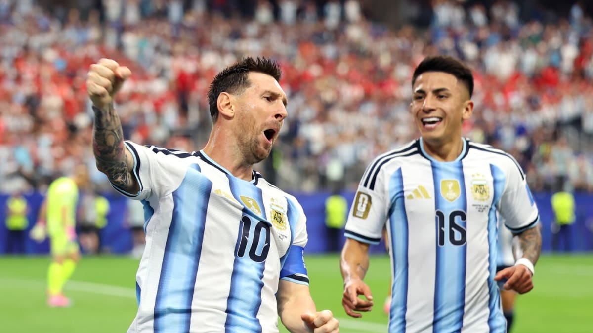 Lionel Messi in Argentina jersey celebrates scoring record-breaking World Cup goal against Austria