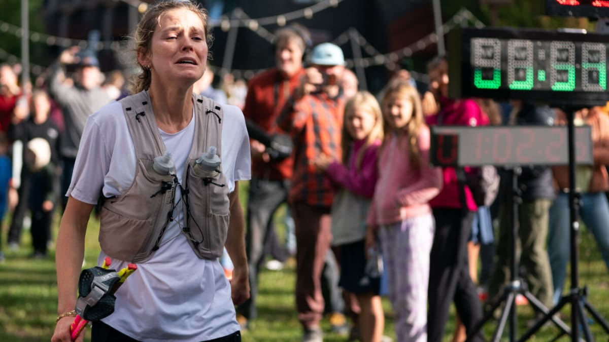 Jessie Diggins crossing finish line of Superior 100 Mile Trail Race in Minnesota