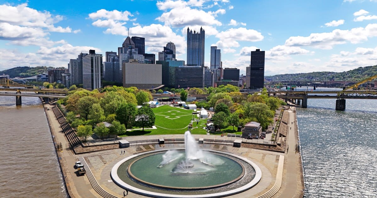 Aerial view of Pittsburgh's North Shore and downtown skyline preparing for NFL Draft crowds