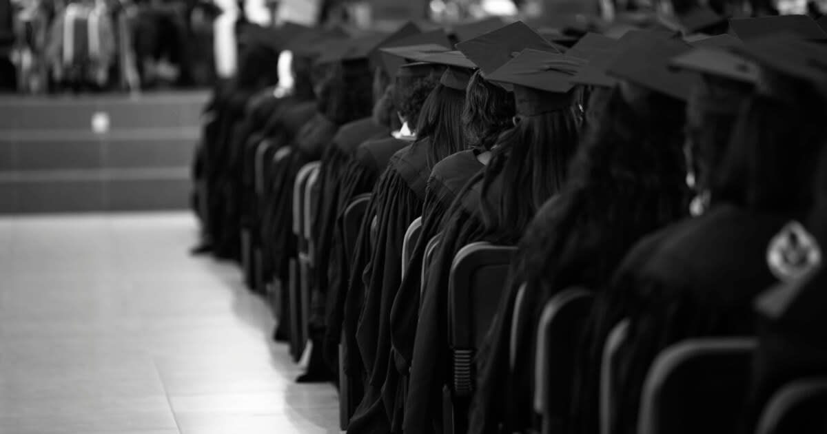 Students in graduation caps and gowns celebrating at Collier County Public Schools commencement ceremony