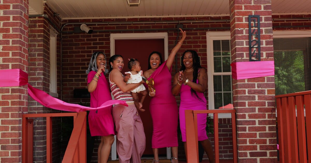 Staff members gather for ribbon cutting ceremony outside new Norfolk substance use treatment center