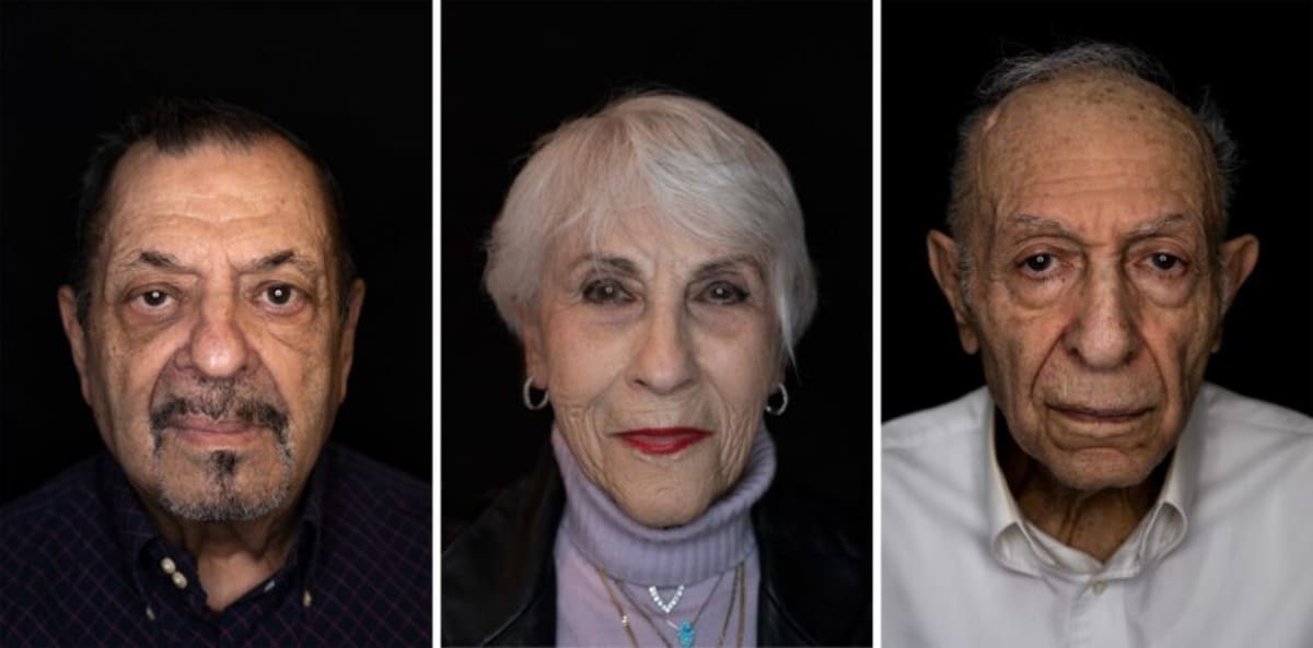Seven-foot-tall portrait photographs of Holocaust survivors displayed outdoors at Chesterfield entertainment district