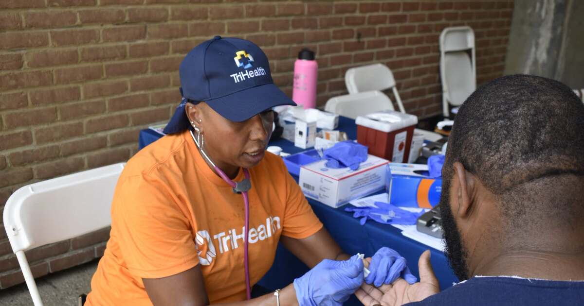 TriHealth medical staff providing free health screenings at outdoor Midwest Black Family Reunion festival