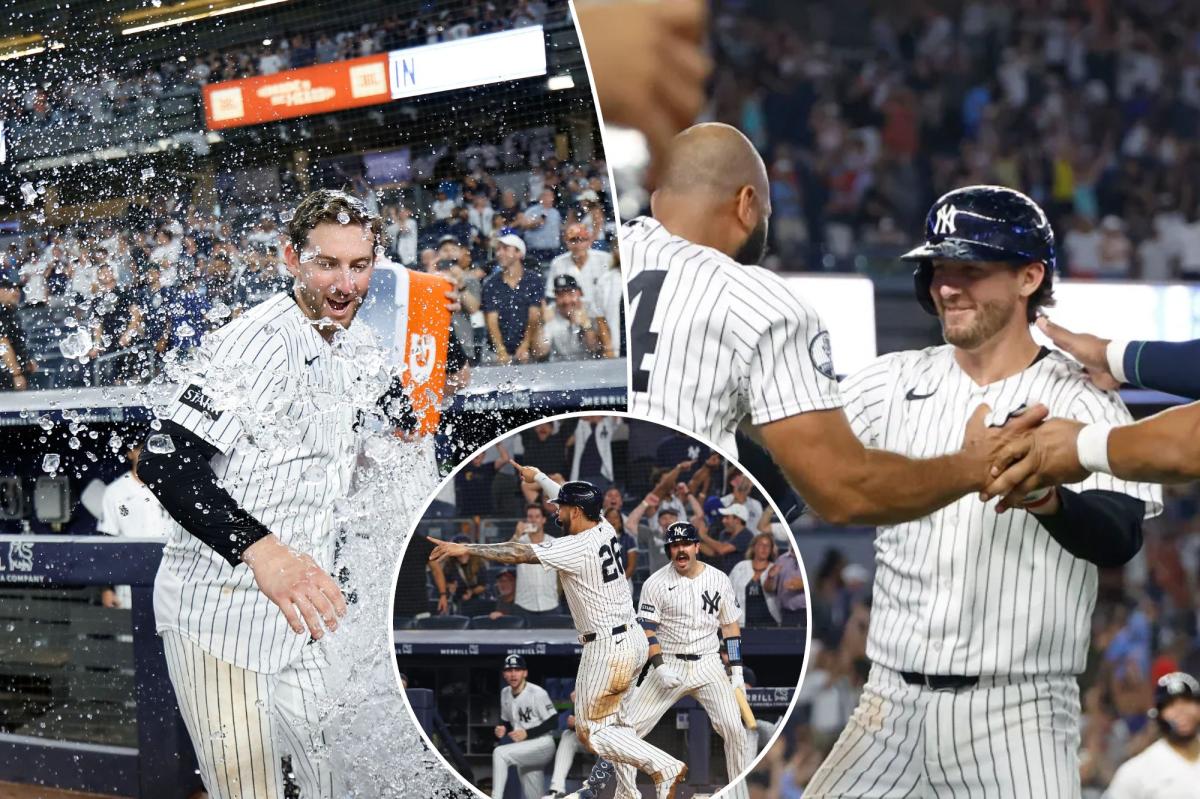 Yankees players celebrating around home plate after Ryan McMahon's walk-off victory