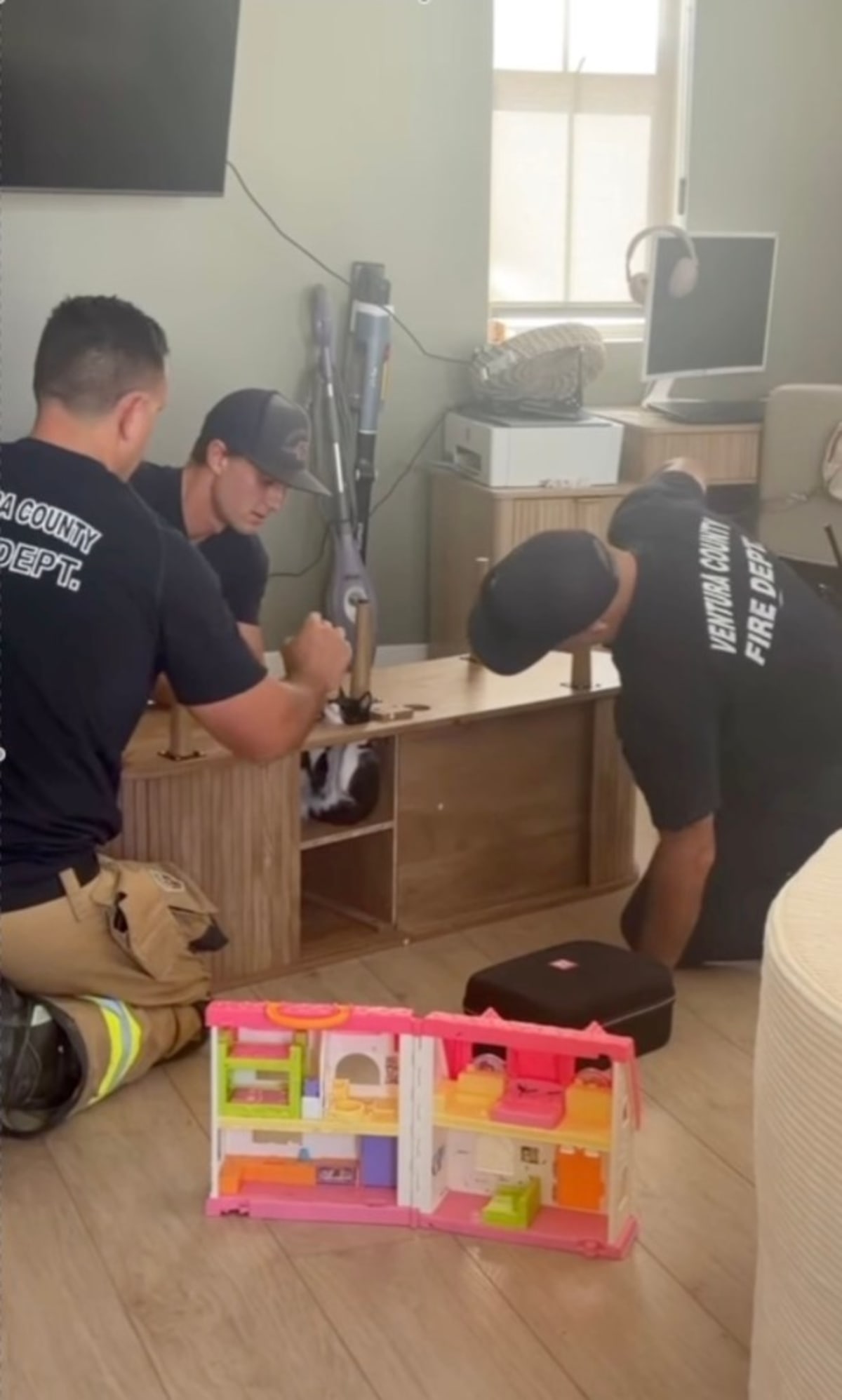Firefighters Save Kitten Stuck in Entertainment Center - Image 3