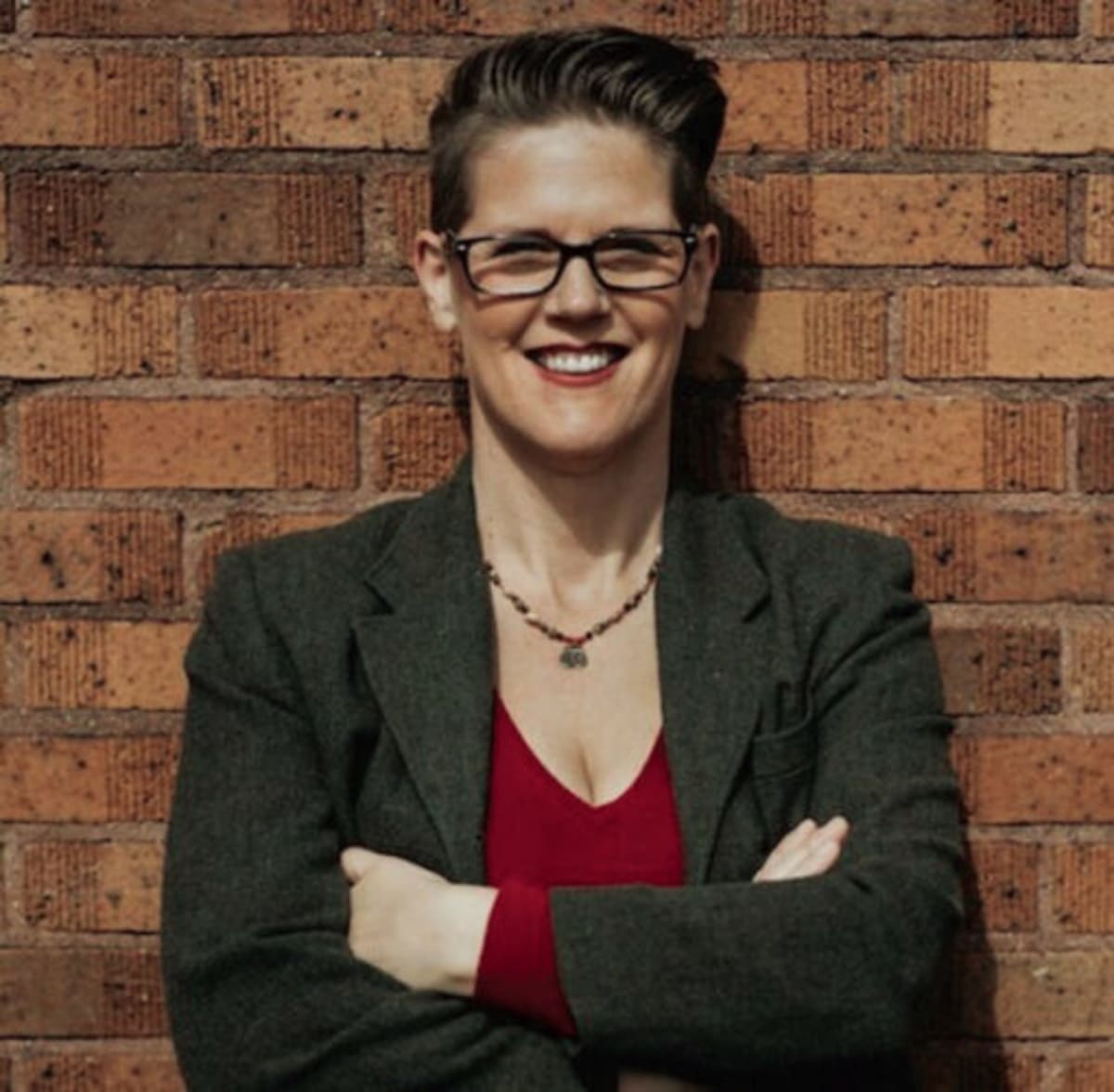 Electric car charging at home station in residential driveway at sunset