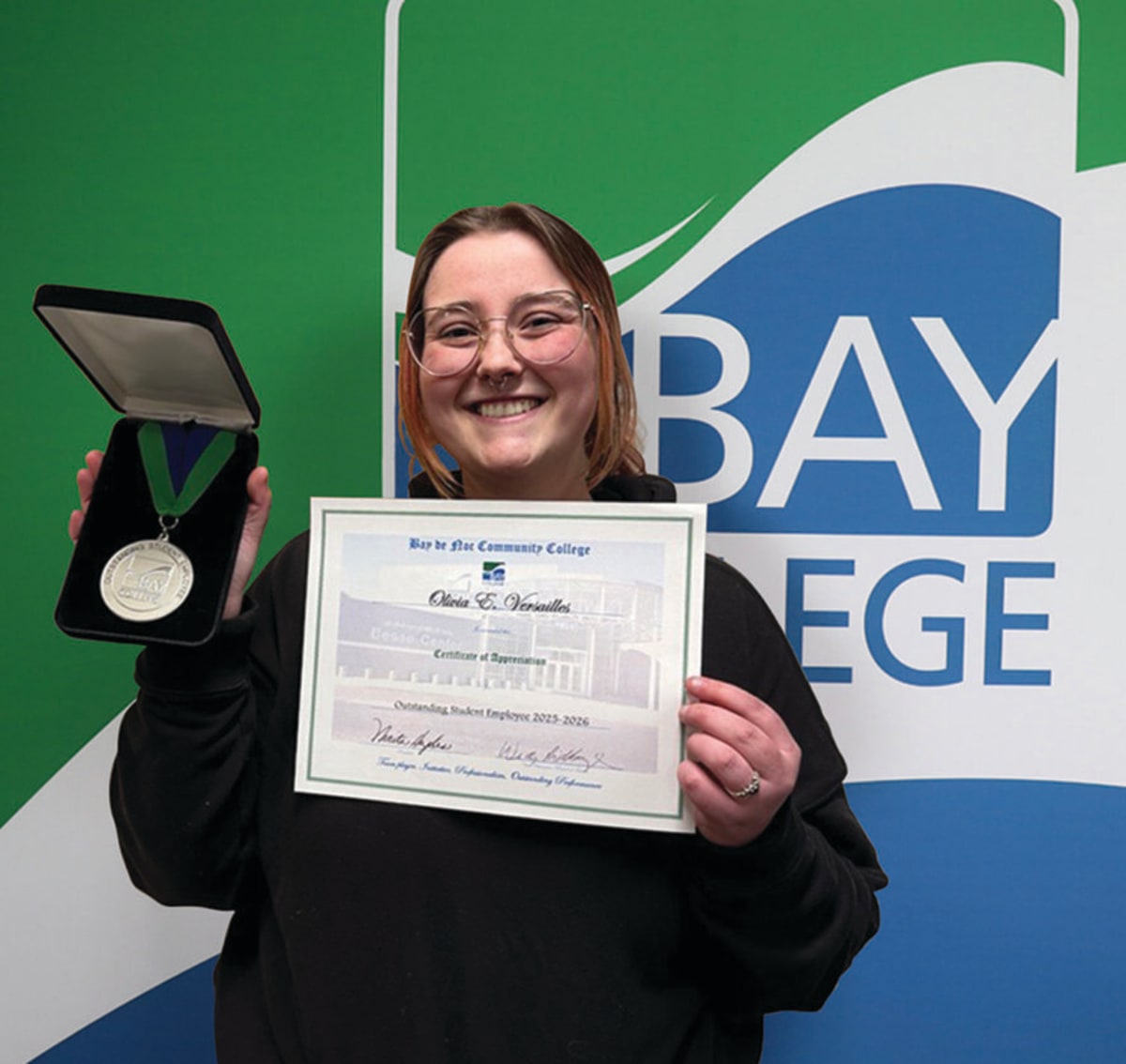 Olivia Versailles smiling, named Bay College's Outstanding Student Employee of the Year