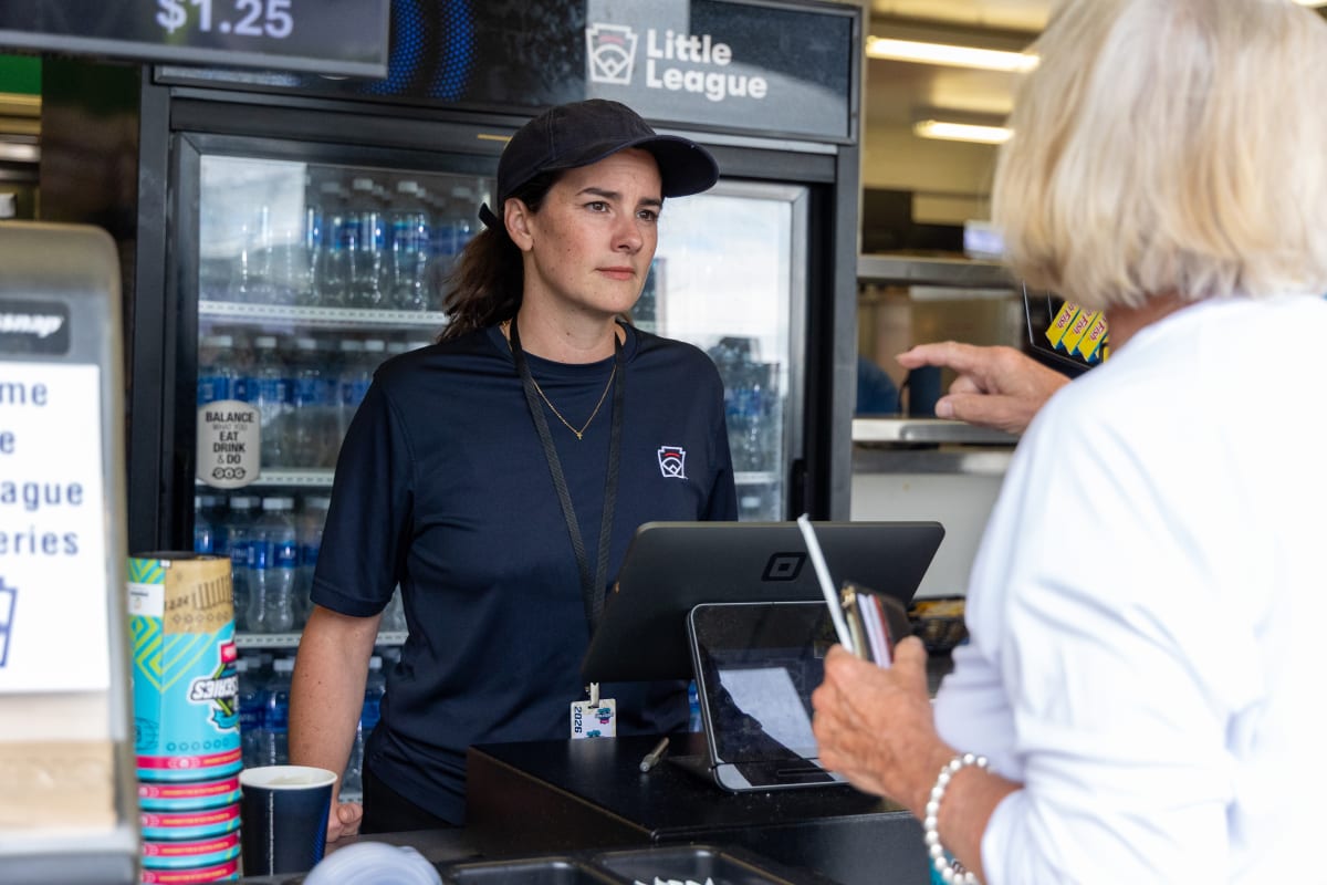 Congressional candidate Rachel Wallace taking orders at Little League World Series concession stand for charity