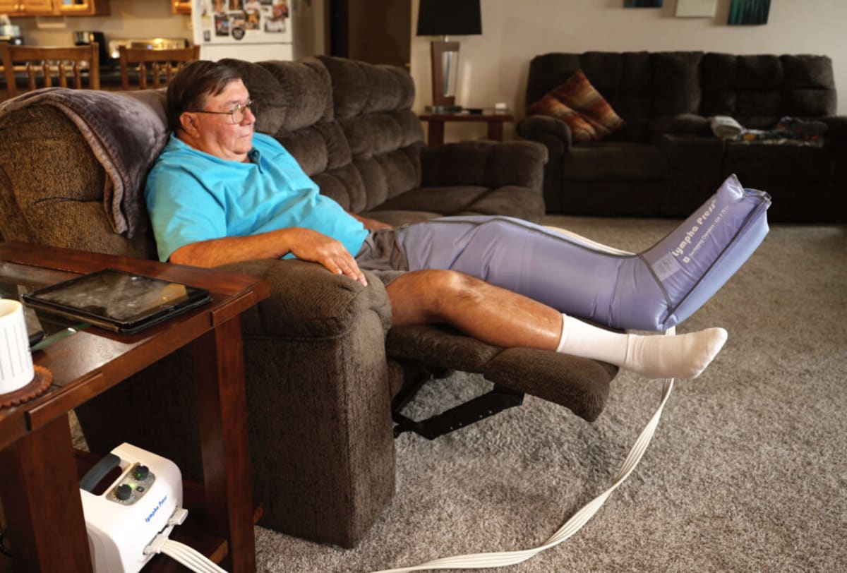 Surgeon performing delicate microsurgery procedure to treat lymphedema in cancer survivor patient