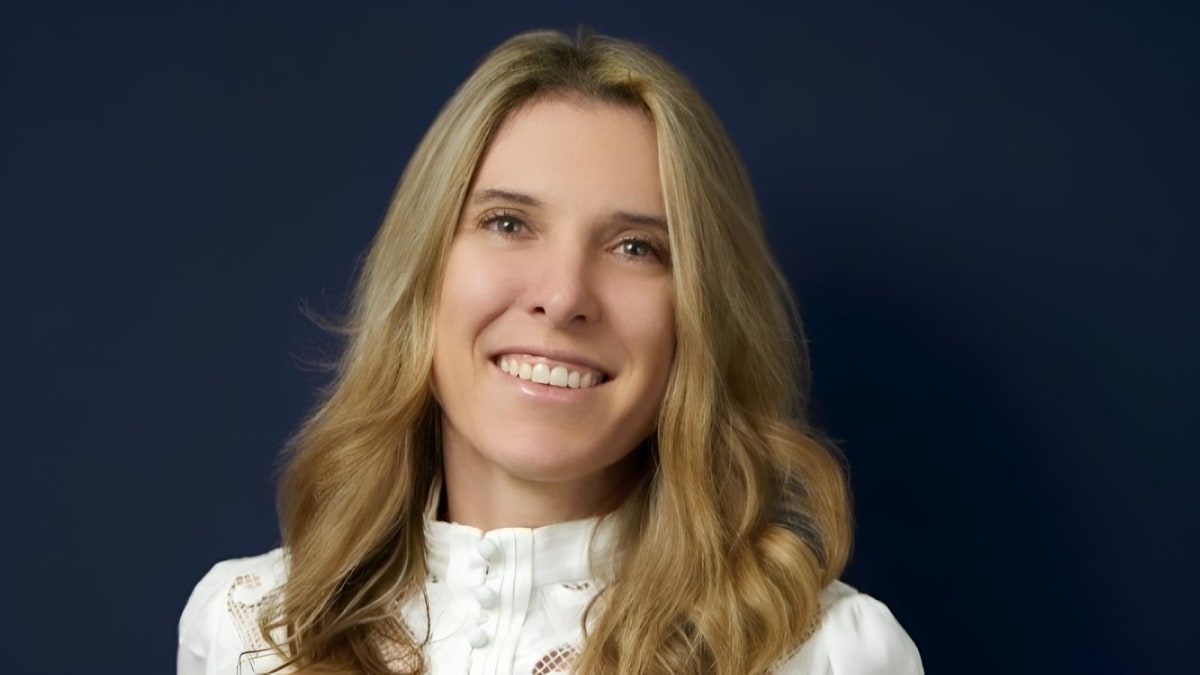 Cancer survivor volunteer speaking with and supporting a patient in Uganda healthcare setting