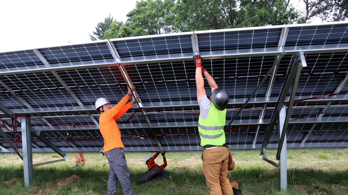 Solar panels being installed on rooftops in Portland's Cully neighborhood for low-income residents
