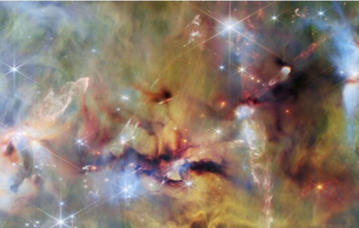 James Webb telescope infrared image showing colorful gas clouds and baby stars forming in Orion
