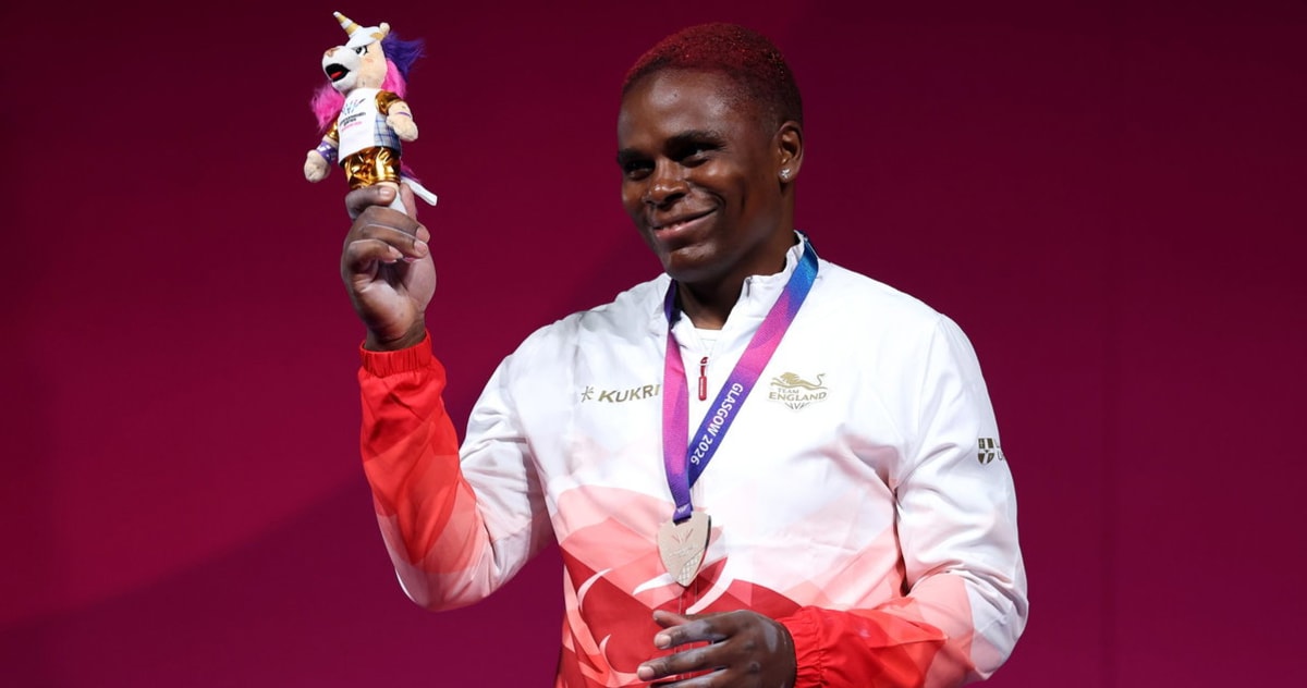 Madias Nzesso Ngake celebrates on podium after winning Commonwealth Games silver medal for England