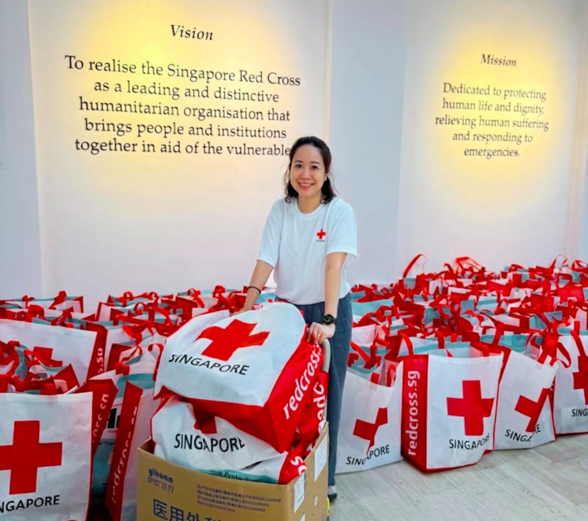 Singapore Red Cross staff using AI technology platform for humanitarian disaster response coordination