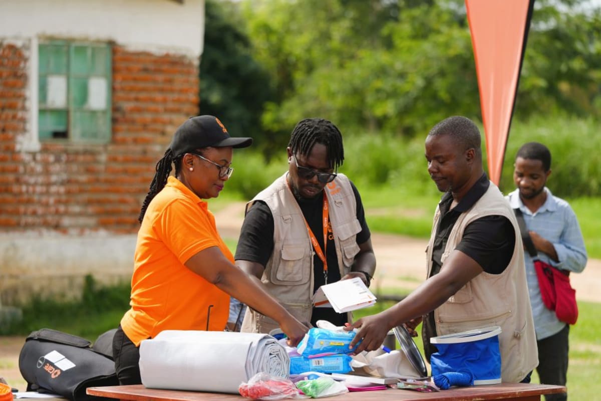 Three waterproof emergency supply bags designed for CARE humanitarian disaster relief operations