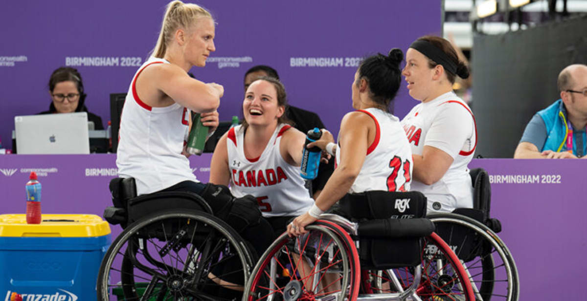 Wheelchair basketball players competing on indoor court during Commonwealth Games action