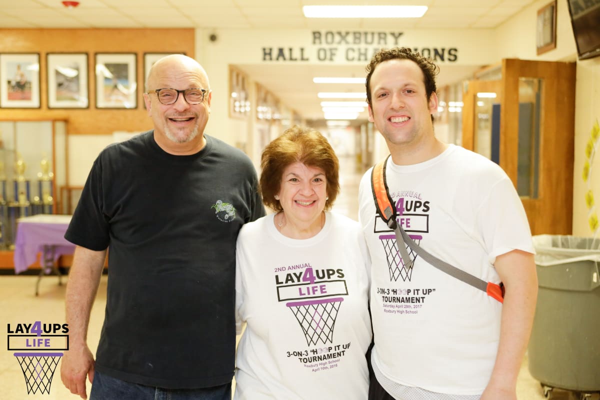 Dan Exter with parents Sheldon and Carol, cancer survivor and Layups 4 Life founder