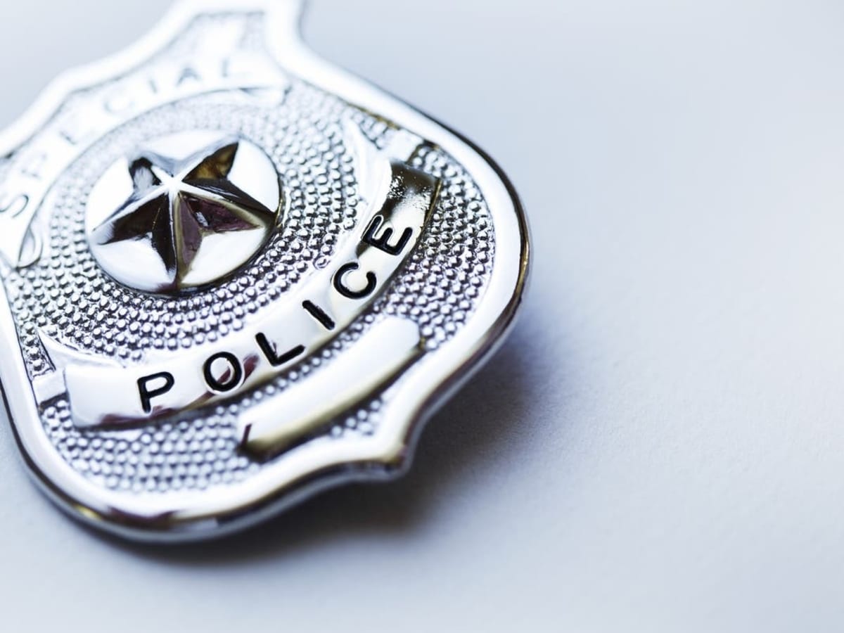 School resource officer badge and award ceremony celebrating community hero recognition for student mentorship