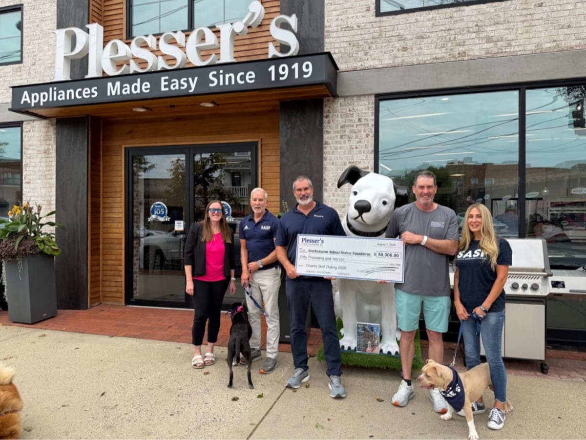 Representatives from Plesser's Charity Foundation and Southampton Animal Shelter Foundation celebrating donation presentation at appliance store