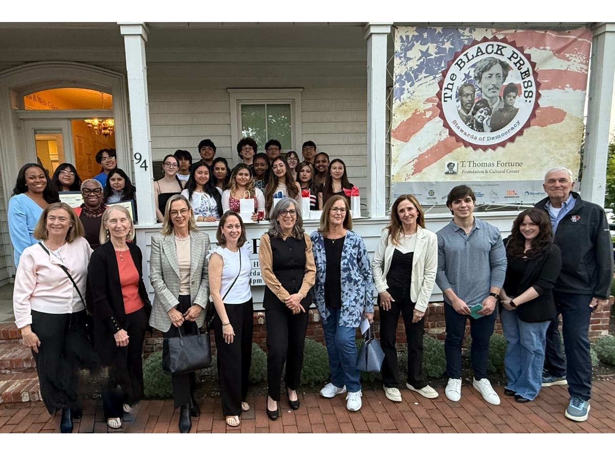 2026 Alliance for Student Success graduates pose with mentors and program coordinators at ceremony