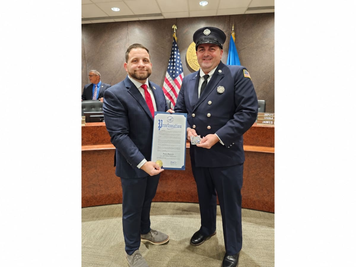 West Babylon firefighter Peter Daniele being honored at Suffolk County's volunteer firefighter recognition ceremony
