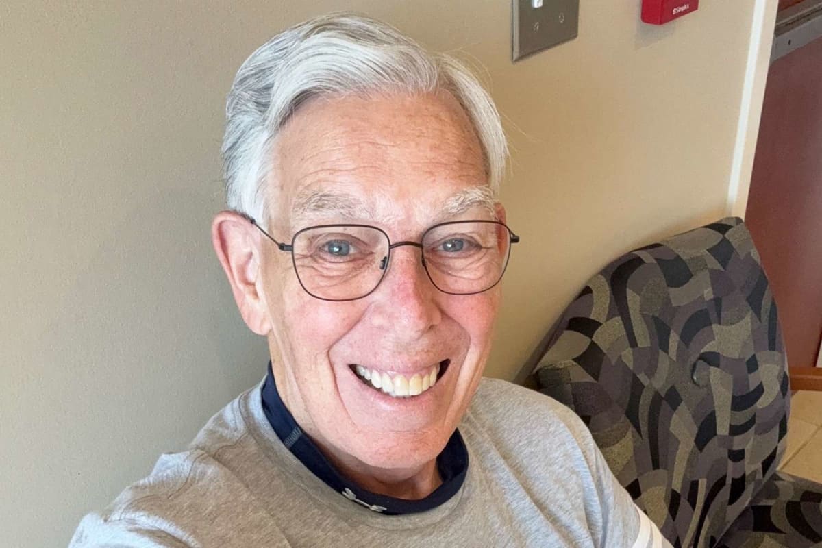 Bob Lane smiling outside Urology Specialists of the Carolinas clinic where he volunteers
