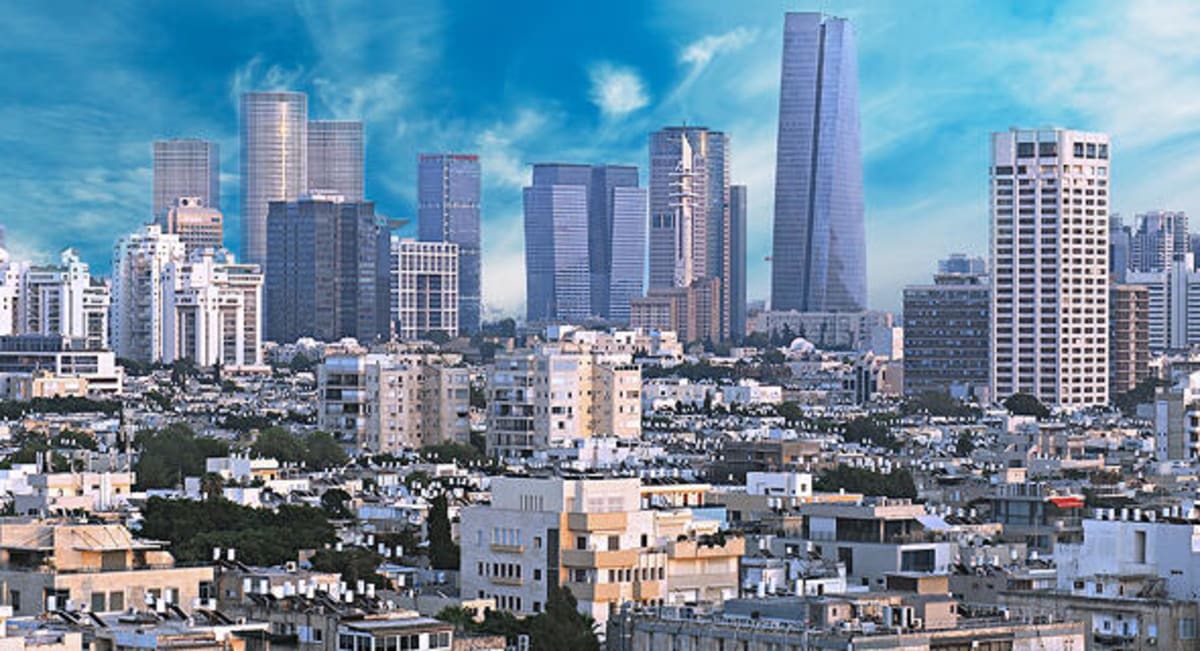 AI researchers collaborating on advanced technology projects in modern Israeli innovation center workspace