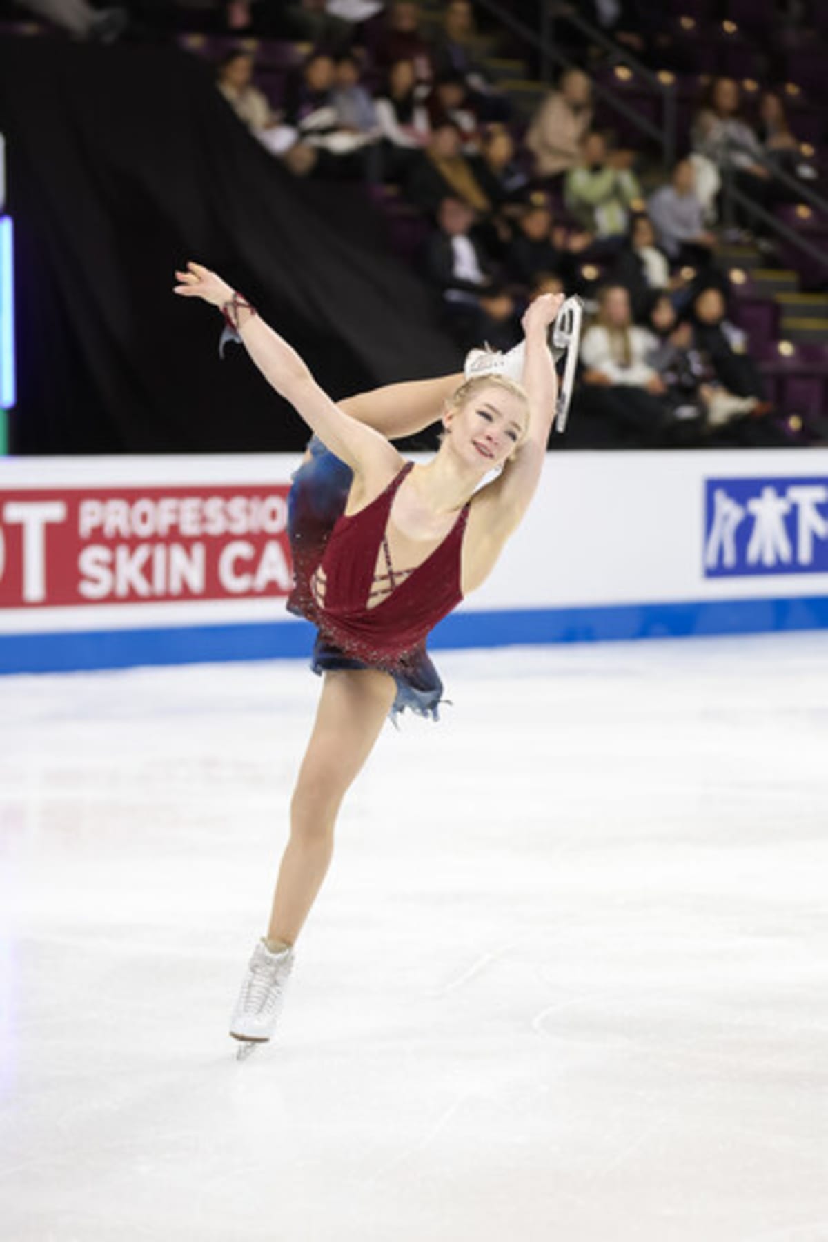 Olympic figure skater Amber Glenn performing on ice in Team USA uniform