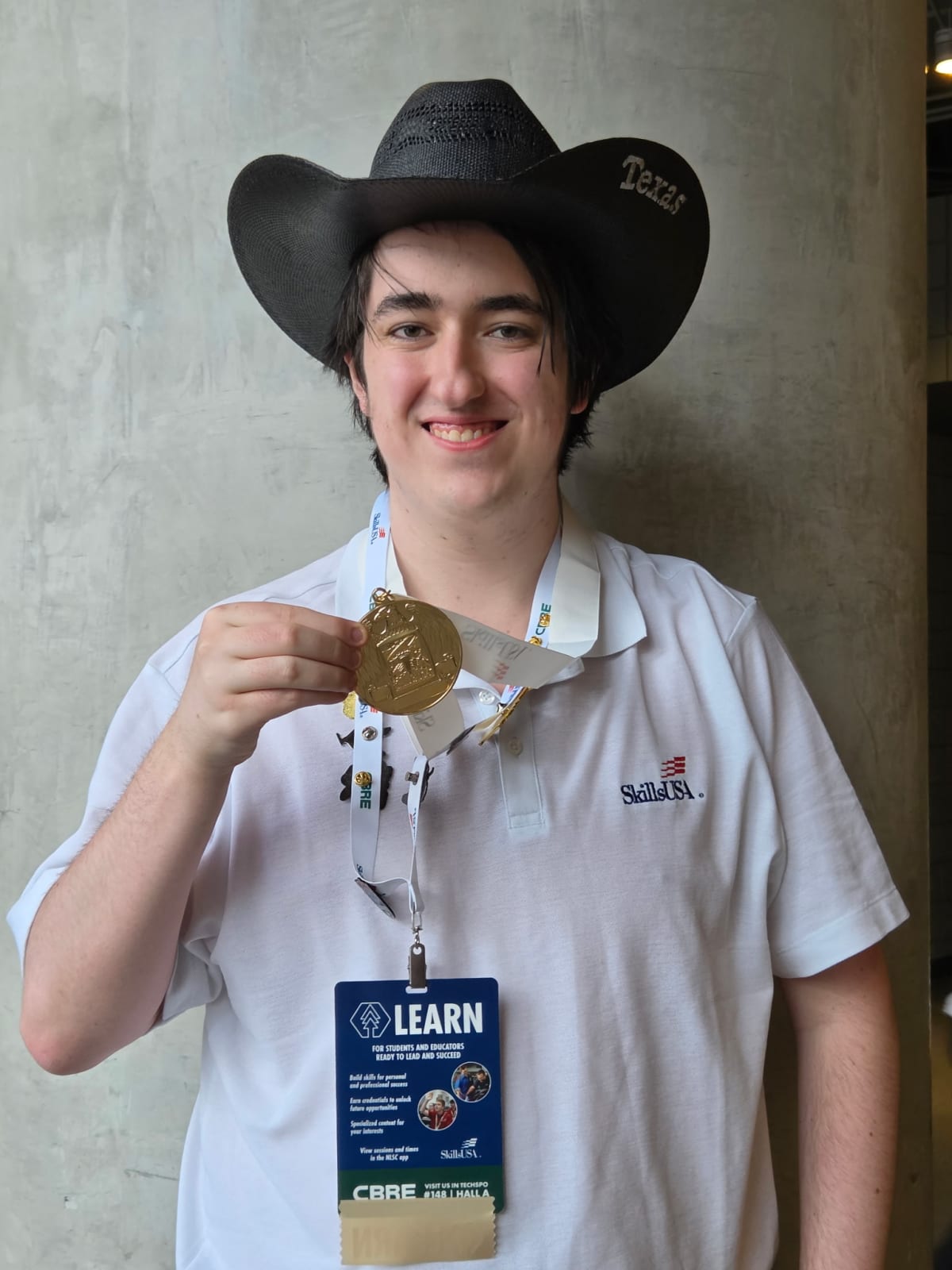 Texas high school and college students holding gold medals at national skills competition