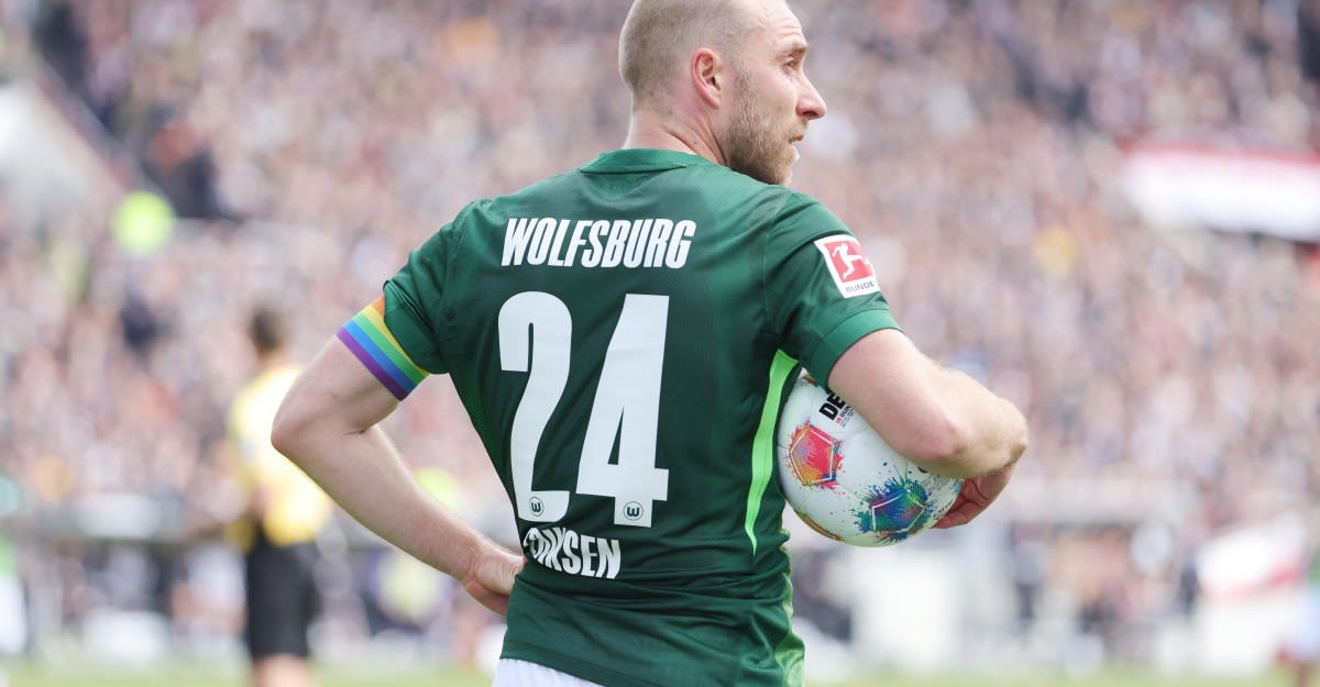 Christian Eriksen in VfL Wolfsburg uniform looking on during a Bundesliga match in Hamburg