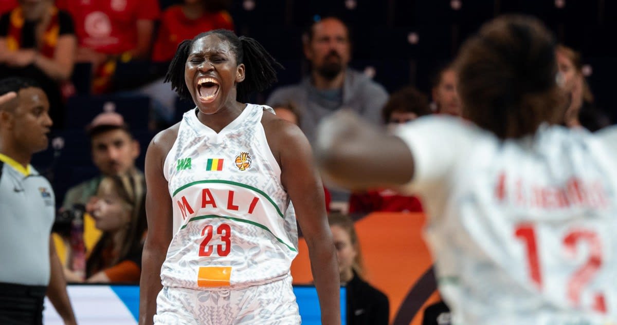 ** Mali women's basketball team celebrating historic World Cup victory over Spain on court