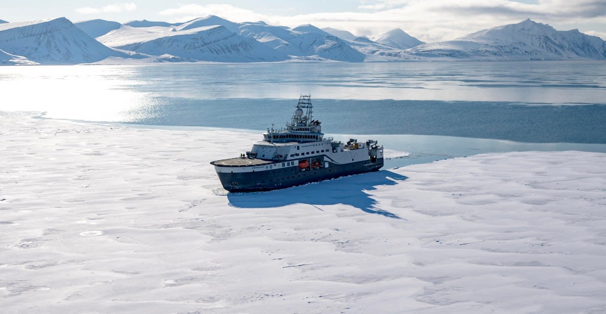 Fiber optic undersea cable being installed on ocean floor by specialized repair vessel