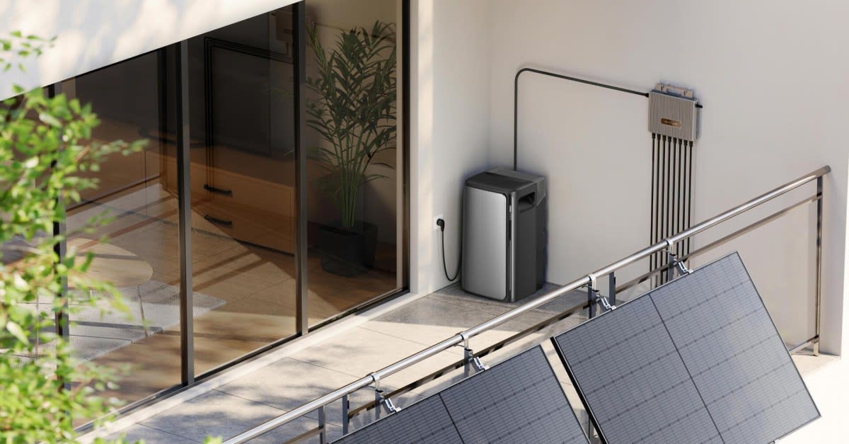 Solar panel mounted on apartment balcony railing plugging into standard wall outlet