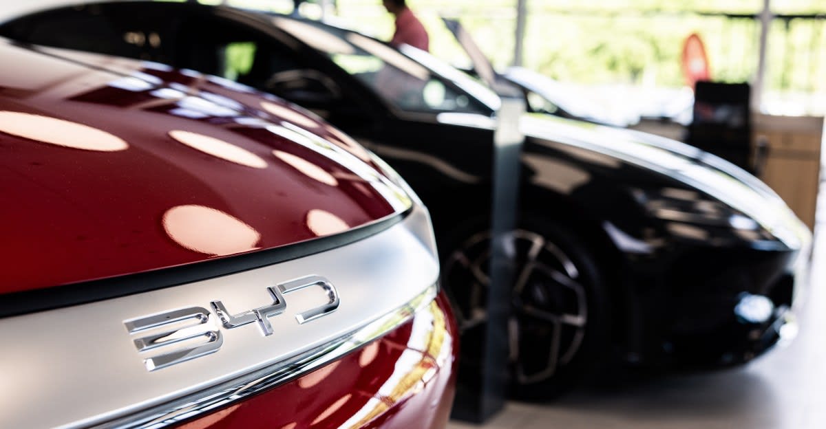 Modern electric vehicle charging station with sleek design connecting to car