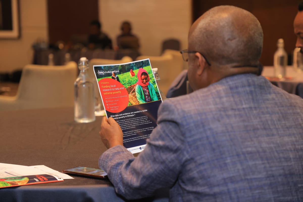 Ethiopian researchers reviewing data and discussing local development solutions in collaborative meeting