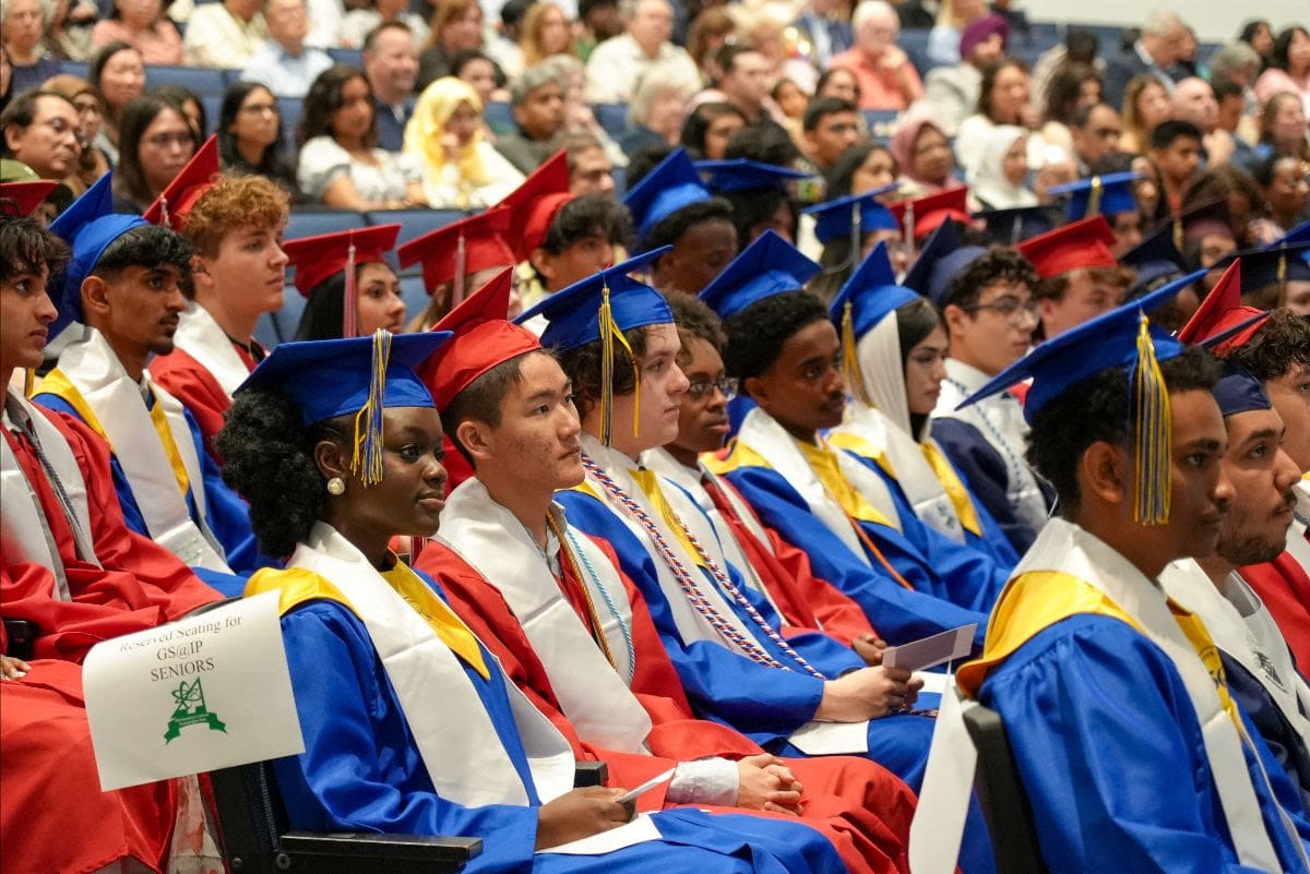 Graduates in caps and gowns celebrating at Governor's School at Innovation Park ceremony