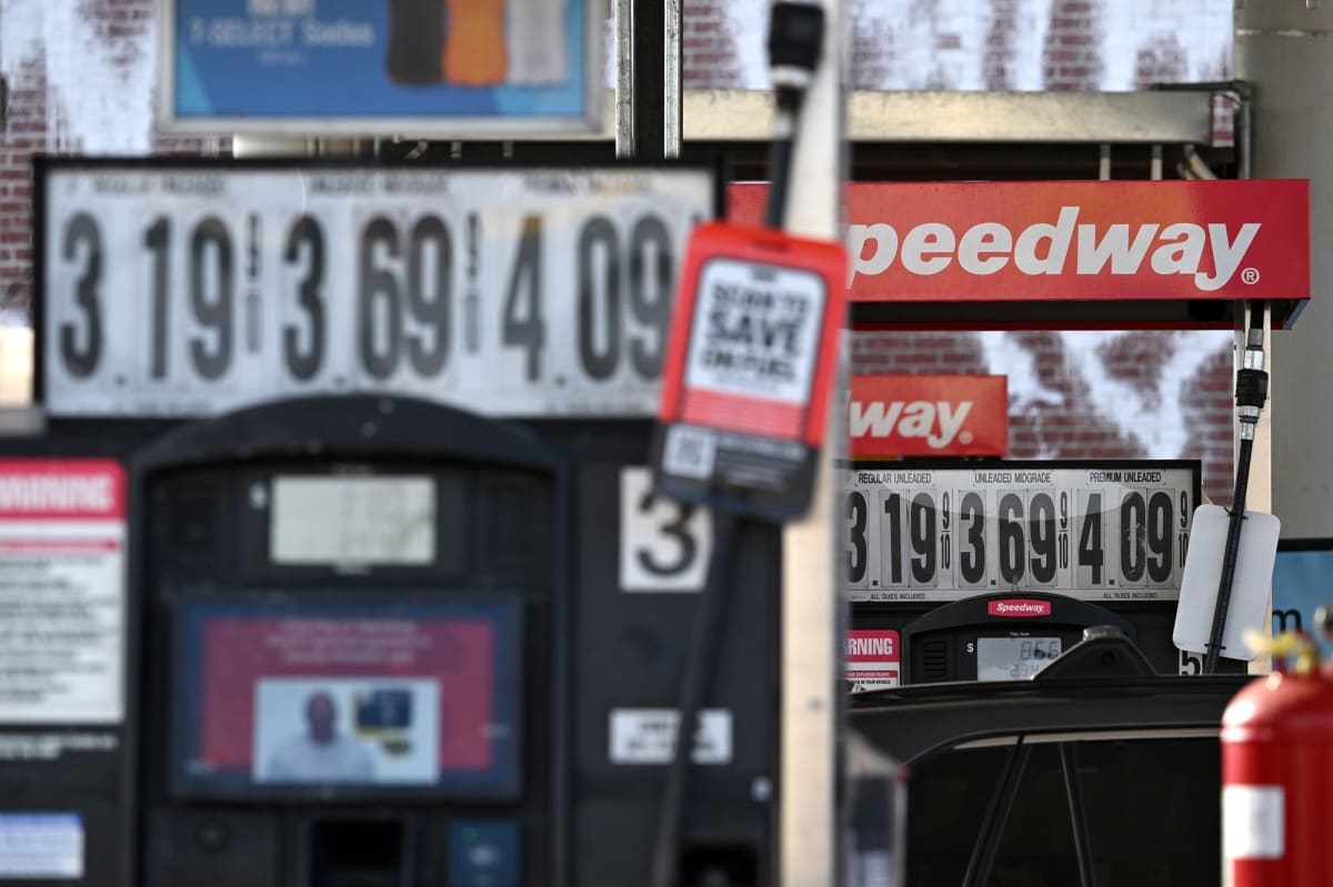 Hyundai Kona electric vehicle charging at home with solar panels visible in background